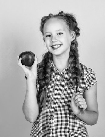 healthy smile. smiling kid hold red apple. vegetarian diet. autumn harvest.の写真素材
