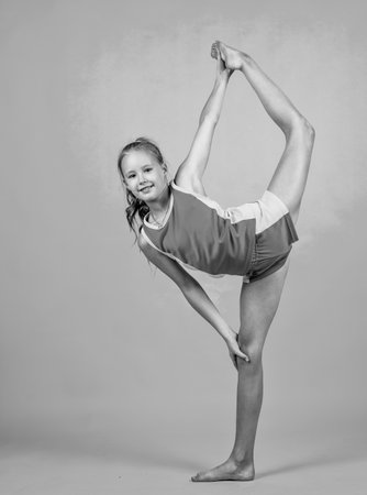 teen girl wear sportswear for training gymnast in split, stretchingの写真素材