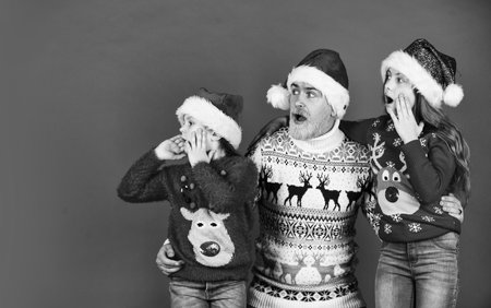 Surprising miracle. Dad kids having fun. Father and little daughters celebrate new year together. Christmas becomes special with children. Christmas eve concept. Family time. Holly jolly christmasの写真素材