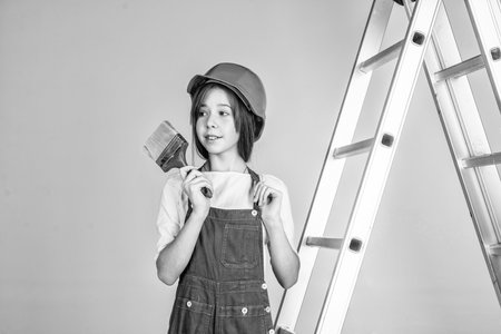 building and construction. child architect worker. engineer use painting brush.の写真素材