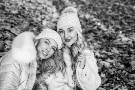 For keeping you warm through cold weather. Happy girls in warm clothes outdoors. Fall fashionの写真素材