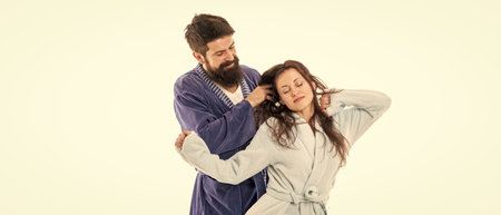 Good morning. Man hold hair of sleepy woman. Family couple in love. Wake up. Early morning