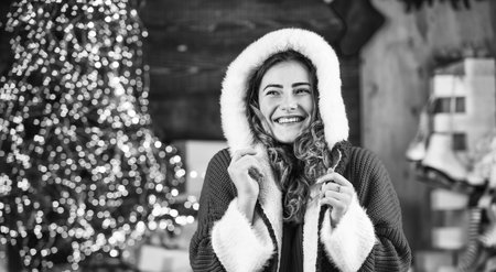 Happy girl at christmas tree. Santa is near. Decorate home. Xmas spirit. Family holiday celebration. Happy new year. Woman santa costume. Winter shopping sale. Celebrate holiday. Holiday traditionの写真素材
