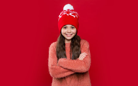 teen kid wear sweater and hat in studio. winter fashion for teen kid. hat knitwear. teen kid modelの写真素材