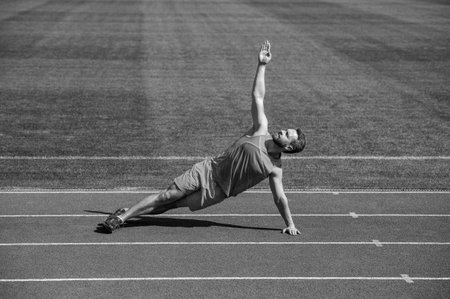 athletic muscular man warming up before training, yogaの写真素材