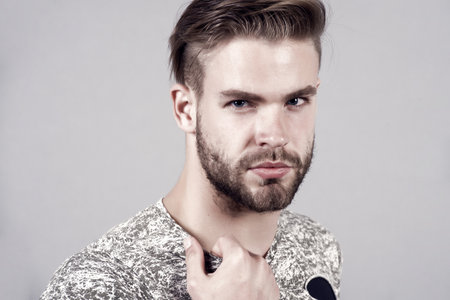 Macho with bearded face and stylish hair, haircutの写真素材