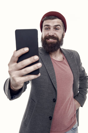 Lifestyle blogger. Share life online blog. Digital influencer concept. Video call communication. Online stream. Personal blog social networks. Handsome hipster taking selfie photo for personal blogの写真素材