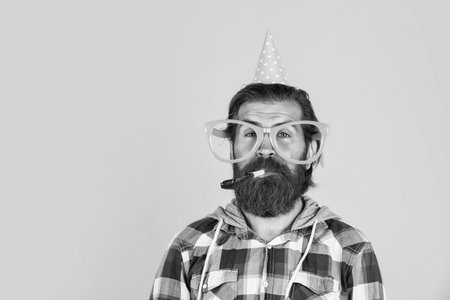 happy birthday to you. male holiday celebration. bearded guy with party accessory. unshaven brutal...
