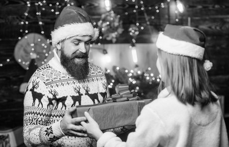 They love Christmas. winter holidays. Seasonal shopping sales. santa family together. Loving couple xmas gifts. happy new year. xmas surprise. couple in love. merry christmasの写真素材