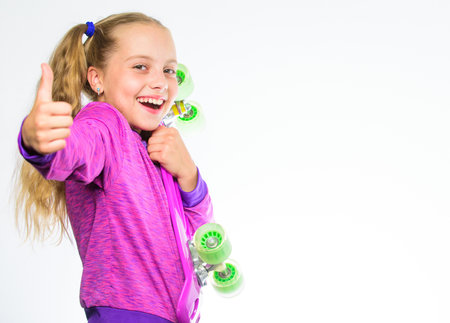 Child hold penny board. Penny board of her dream. Best gift for kid. Kid long hair carry penny...