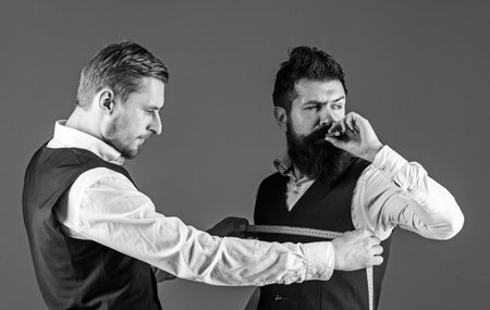 Client with beard and strict face smoke cigar and drink