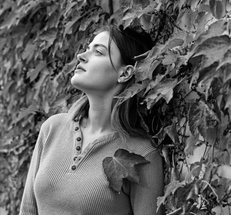 Autumn season and beauty concept. Woman with dreamy faceの写真素材
