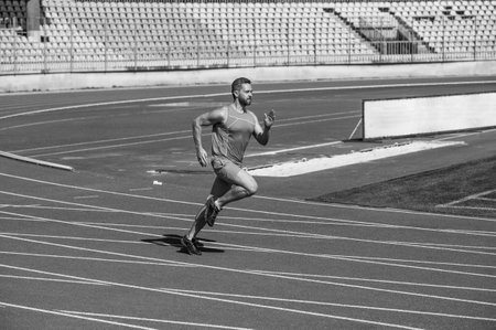 energetic and sporty. marathon speed energy. muscular man in motion. athletic manの写真素材
