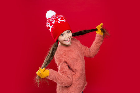 winter fashion for teen child having fun. hat knitwear. teen child model in hat. teen child in hat