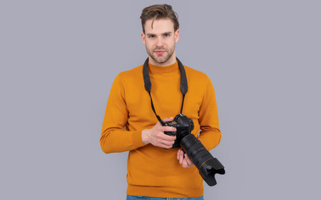 man photographing hold photo camera. photo of man photographing with camera.