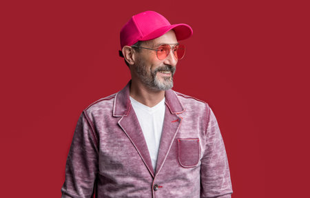mature stylish man wearing cap in studio. mature man wear stylish jacket.