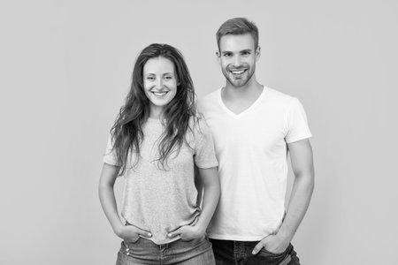 happy sexy young couple in love on yellow background, relationship