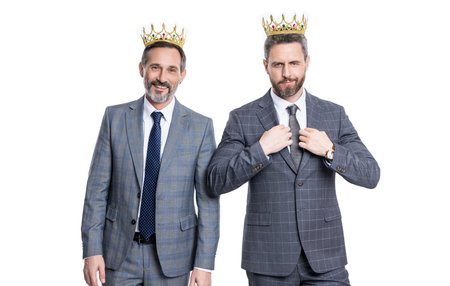 positive successful businessmen in crown at studio. successful businessmen in crown.