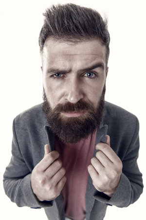 No man is born stylish. Stylish hipster wearing elegant jacket with casual jeans. Bearded man with stylish haircut. Caucasian guy with stylish moustache and beard hair shape on unshaven faceの写真素材