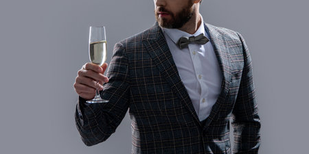 cheering and celebrating concept. man in tuxedo cheering and celebrating in studio.の写真素材