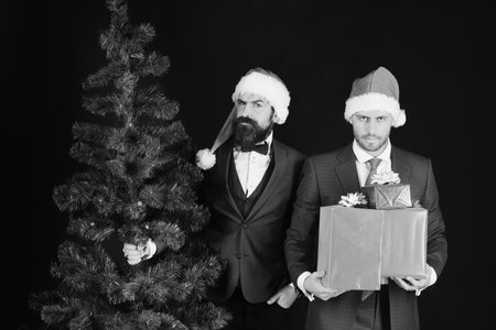 Business and winter vacation concept. Businessmen with strict facesの写真素材
