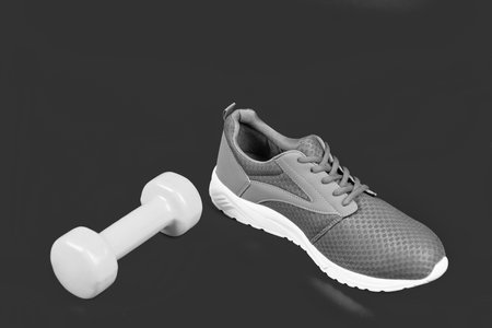 footwear for training with dumbbell on pink background, sportの写真素材