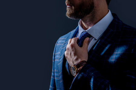 cropped view of businessperson in wristwatch and suit. businessperson in wristwatch isolated on greyの写真素材