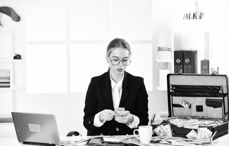 Taxation. Tax service. Owner of small business. Analyzing financial report. Accounting and banking. Accountant learn indicators markers. Financial success. Financial expert. Woman counting moneyの写真素材