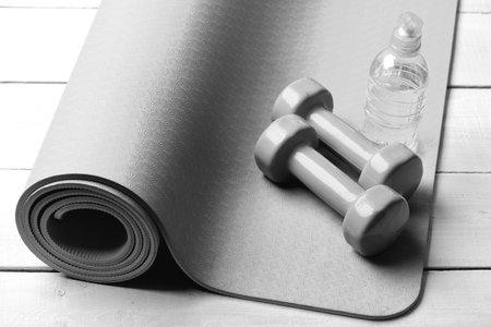 Shaping and fitness equipment. Dumbbells made of green plasticの写真素材