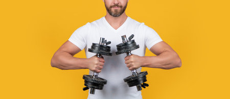 cropped view of muscular fitness guy with barbell isolated on yellow. muscular fitness guyの写真素材