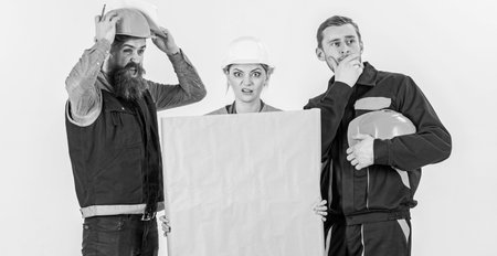 Builder, engineer, architect confuse at work. Confusing concept.の写真素材