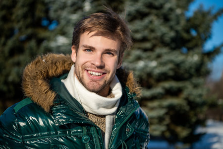 cheerful stylish man in winterwear outdoor. man in winterwear at holidays.の写真素材