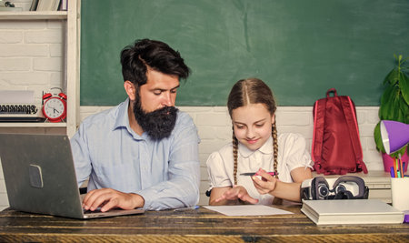 Find buddy to help you study. Private lesson. School teacher and schoolgirl with laptop. Study...