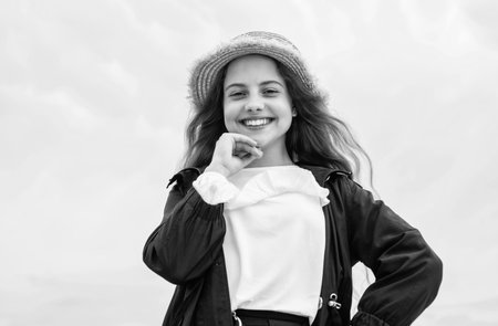 happy teen girl wear hat outdoor on sky background, childhood