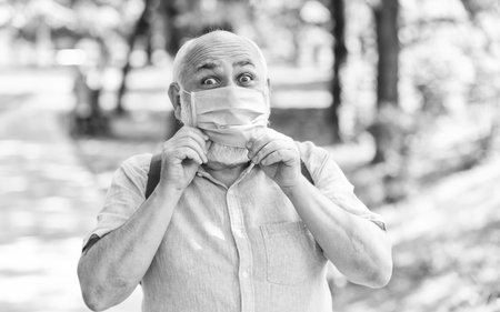 strategy in battling virus. prohibition on visiting public places. senior man in mask. old man...