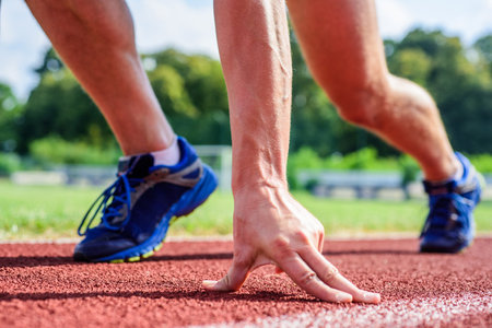 Runner ready to go close up. Ready steady go concept. At beginning of great sport career. Hand touch...