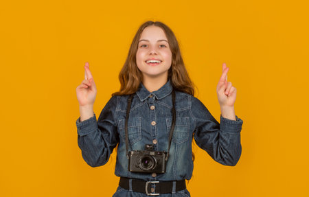 Good luck. Superstitious child photographer. Keeping fingers crossed for luck. I feel luckyの写真素材