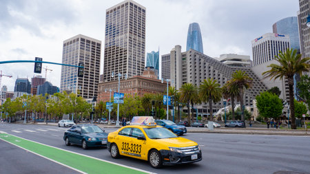 San Francisco, USA - May 19, 2019: yellow taxi car on the road of san franciscoのeditorial素材