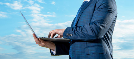 Businessman crop view working on business computer. Running business online. Business communicationの写真素材