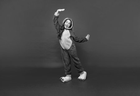 comfortable pajama or home bathrobe. teen girl feeling relaxed. childhood happiness.の写真素材