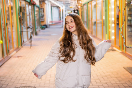 teen curly girl laugh outdoor. teen curly girl wearing hat. photo of teen curly girl outside.の写真素材