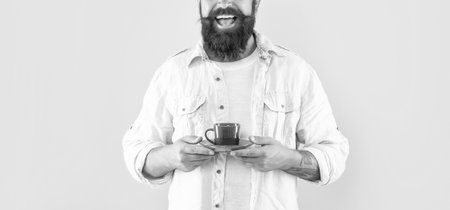 cropped happy unshaven man in shirt with coffee on yellow background, morning