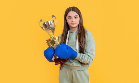teen boxing girl isolated on yellow. teen boxing girl in studio. teen boxing girl on background.の写真素材