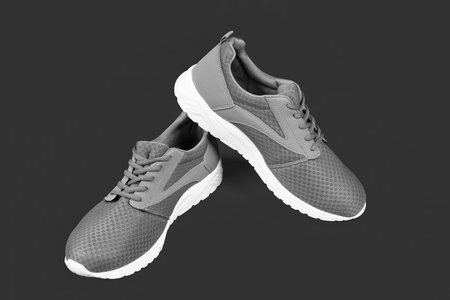 pair of comfortable blue sport shoes on pink background, new pair