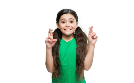 teen brunette girl wearing green tshirt crossed finger. photo of teen brunette girl