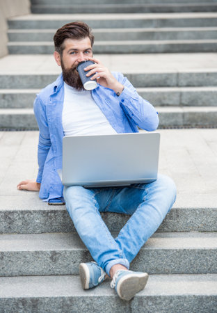 communication of cheerful freelancer man outside. freelancer man has communicationの写真素材