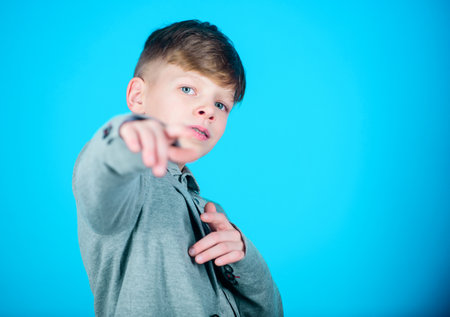 Know lot about style. Found his style. Boy modern hairstyle wear formal style suit blue background....