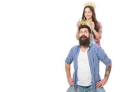 Father and kid with golden crown. We are just best. King and princess concept. Bearded hipster and little daughter. Family heritage. Crown richness and monarchy. Crown symbol of royal. Luxury lifeの写真素材