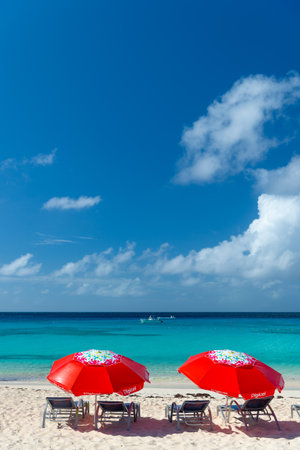 Grand Turk, Turks and Caicos - December 29, 2015: summer seaside beach with sunbed and umbrellaのeditorial素材