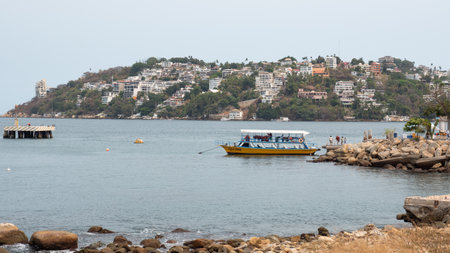 Acapulco, Mexico - May 12, 2019: summer seaside landscape with port or harbour and boatのeditorial素材